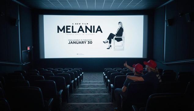 Empty movie theater screening Melania. There are two people in the house wearing MAGA hats.