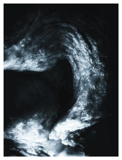 Closeup of the same loaf of bread that highlights one of its swirling contours, desaturated and given a cool-toned glow to resemble a nebula in the darkness of space.