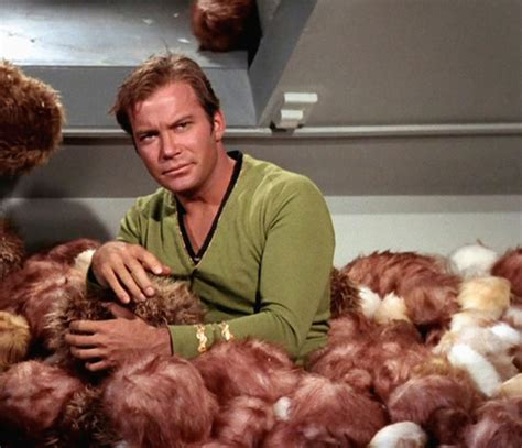 Captain Kirk with a lot of, very many little fluffy aliens overflowing the Spaceship Enterprist. Kirk is almost drowning in this little fluffy fellas .... it's an alien pest befallen the spaceship.