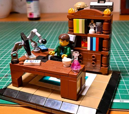 Lego office close up shot. angle desk, with bookcase.