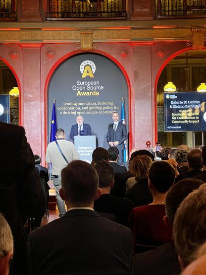 People on stage before an audience