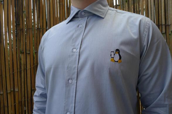 shirt with penguin holding a phone
