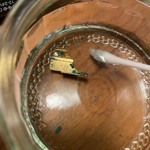 Battery terminal gently fizzing away in some vinegar. Delicious-looking forbidden green crusty flakes float alluringly.