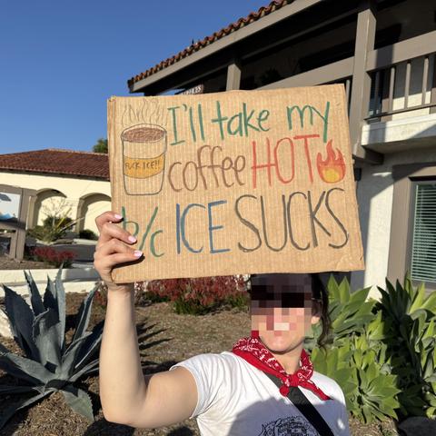 Protestors holding sign reading, “I’ll take my coffee hot because ICE sucks” San Juan Capistrano, CA 2026-01-30