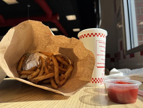 A bag of fries, a burger.