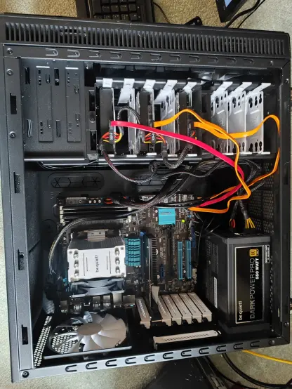 photo of a desktop computer with lid open, showing ssd, 2 sata hard drives, bequiett cpu cooler, bequiett dark power psu