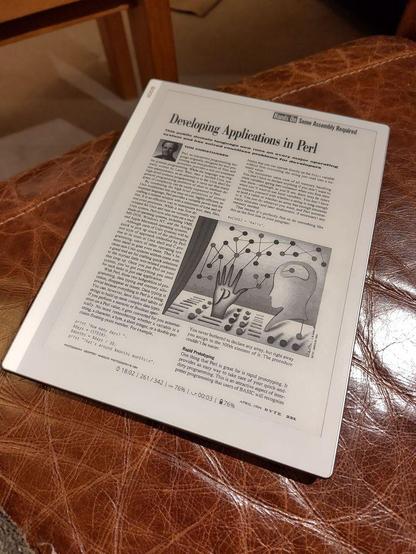 An e-ink tablet showing an article titled "Developing applications in Perl" from BYTE Magazine April 1994