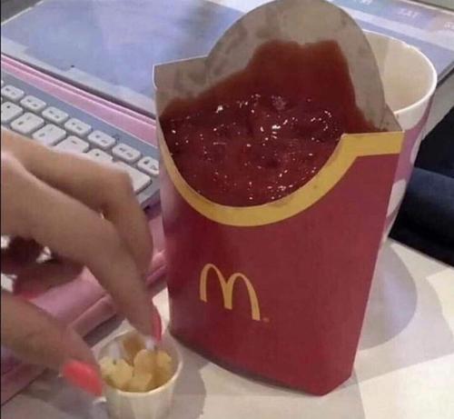 Fry's container full of ketchup