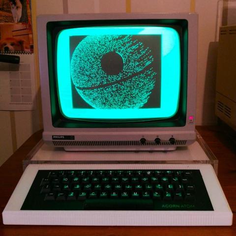 Photo of my Acorn Atom and green screen CRT monitor showing a death star image, rendered by my own mathematical formulea.