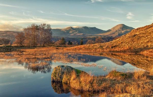 The beautiful Kelly hall tarn in rich sunset light