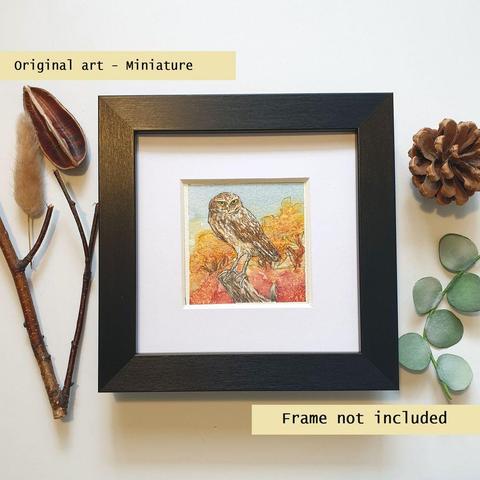 A tiny artwork of a burrowing owl with a semi abstract background of trees and land in yellow and orange tones and a blue sky.
Burrowing owls are small long legged day hunting owls who live underground in burrows. An original art work, please note that the frame is not included.
Watercolour and mixed media on white acid free artist watercolour paper.
Approximately 7.5 x 7.5cm, will fit a 3 x 3 inch photo frame.