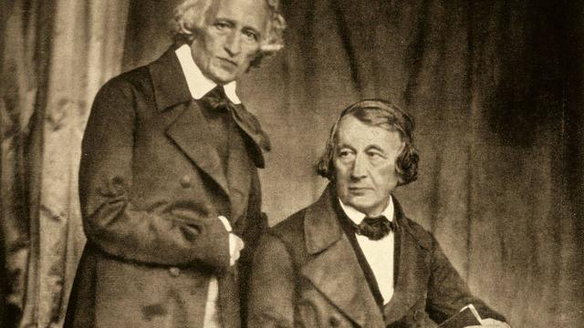 A very early photograph showing the two Brothers Grimm, both of whom are elderly men in dress typical of middle class Germans of the 1840s.