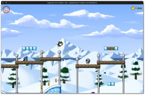 🕶️ A view of its UI (v. 0.7.0 beta 1 on my Linux PC) in the middle of gameplay, where Tux jumps from one wooden platform to another before facing a deadly bouncing metal robot, with a magnificent snow-capped mountain and a clear sky with a few clouds in the background.

📚️ SuperTux is a libre, multi-platform jump 'n run game featuring Tux the penguin in various environments (ice floes, caves, underwater, etc.). Numerous maps designed by users are available via worlds that can be downloaded from the interface. The game also offers a built-in editor. It is a very polished game with numerous traps, bonuses, and enemies, different soundtracks, and full support for recent hardware. It can be played solo or in multiplayer mode (up to 4 players locally). It supports gamepads. 
Version 0.7 renews the fun with completely revamped/improved and more playful content. Excellent!