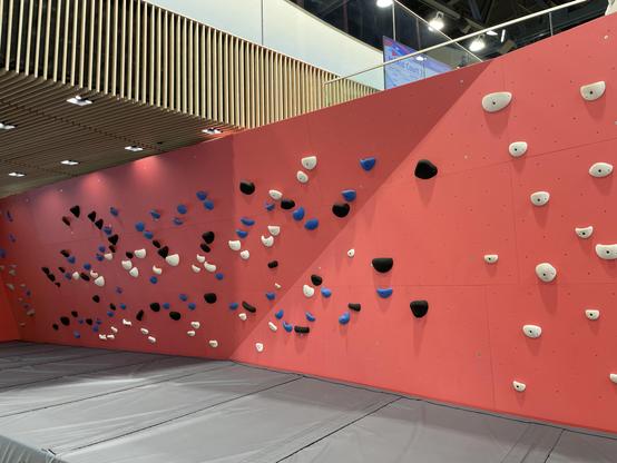 A bright red bouldering wall at Coronation Park Sports and Leisure centre