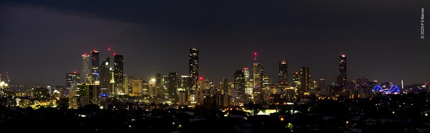 Panoramic view of Brisbane CBD at 4:30 in the morning, Story Bridge in purple at right.