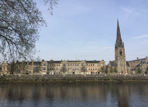 The church is to the right  in this photo of one of Perth’s most attractive streetscapes. The church is in Gothic style with a slender elegant spire overlooking the River Tay. Left and centre are mid-1800s red and blonde sandstone buildings, originally offices, now flats.