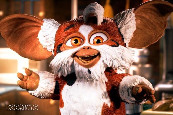 Daffy stands in a Kitchen looking into the camera all giddy