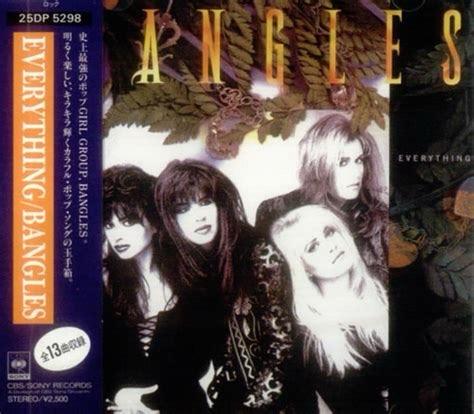 An album cover for "Everything" by the Bangles, featuring four female band members posing together. The design includes a decorative background of leaves. The color scheme is mainly dark with accents in yellow and green.