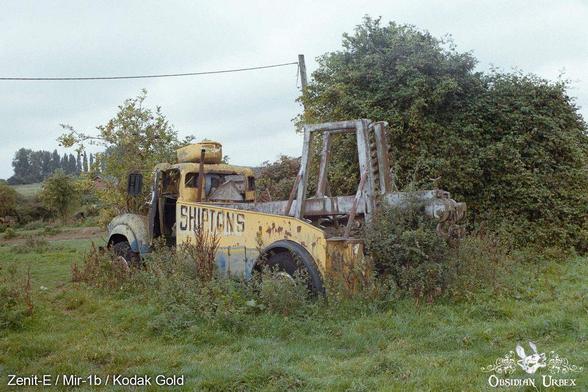 old tow truck overgrown