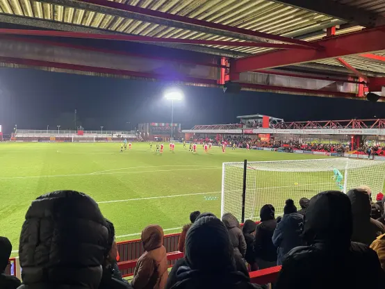 View from the terrace at the Wham Stadium as Ollie Clark takes a goalkick toward the end of the game.