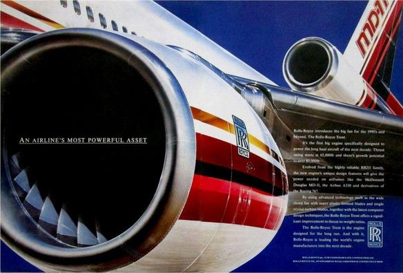 The image is a two-page magazine advertisement featuring a close-up view of a McDonnell Douglas MD-11 aircraft in flight, dominated by a large jet engine nacelle in the foreground. The left page is filled almost entirely by the front of a turbofan engine, shown from a slight angle so the circular intake and fan blades are clearly visible. The engine cowling is white with horizontal red, orange, and yellow stripes. The Rolls-Royce logo appears on the side of the engine. Against the dark interior of the engine intake, white text reads, “AN AIRLINE’S MOST POWERFUL ASSET.”

The right page shows the rear section of the aircraft, including the MD-11’s distinctive tail-mounted third engine and vertical stabilizer, set against a deep blue sky. The tail fin carries bold red striping and the letters “MD-11.” A block of white text occupies much of the right page, describing the Rolls-Royce Trent engine, its thrust ratings, design features, and suitability for long-haul aircraft such as the MD-11, Airbus A330, and Boeing 767. Near the bottom right is the Rolls-Royce logo, along with small corporate text identifying Rolls-Royce PLC.

The overall composition emphasizes engine scale and power, with the aircraft’s fuselage and tail receding into the background while the engine intake dominates the visual field.