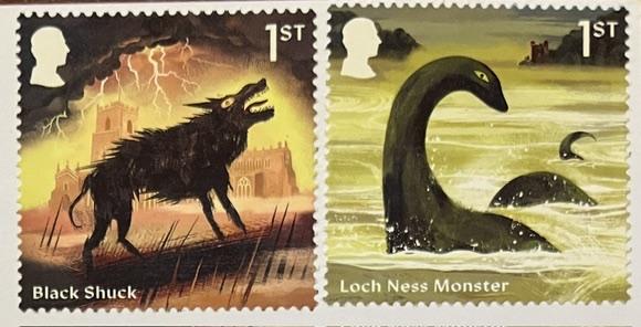 Two Royal Mail first class stamps from their recent "Myths and Legends" series, one showing Black Shuck, a ghostly black dog which supposedly roams East Anglia, and the other showing the Loch Ness monster. Both also bear a profile portrait of a proper Charlie.