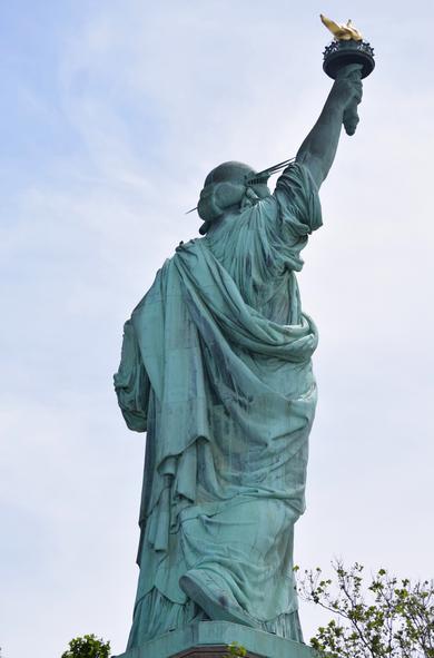A rear view of the Statue Of Liberty by AskALot! on Wikimedia Commons