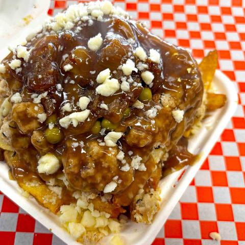 Newfie Fries Poutine --Newfie Fries (fries, dressing, peas, fried onions, gravy and cheese curds, from Manitou Takeout, Kitchener