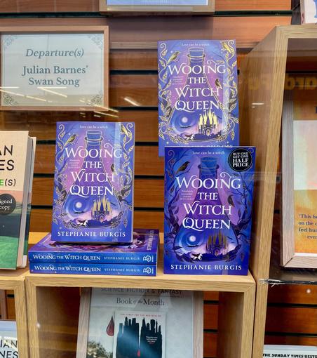 A display of Wooing the Witch Queen copies in the front window of Waterstones Aberystwyth.