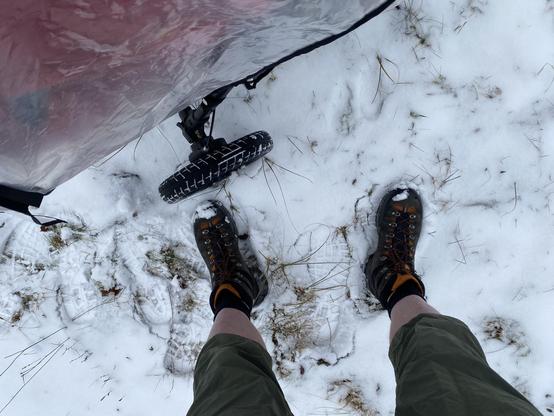 Me wearing shorts. There's snow and toddler is sleeping quietly in the stroller.