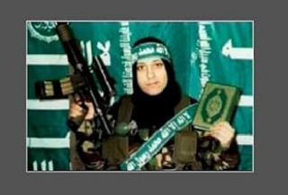 The image (https://www.amazon.de/-/en/Sweet-Death-Losif-Goldman/dp/B006TXDQQC) shows a young woman in front of a green flag covered with white Arabic script, holding a rifle and a Koran.