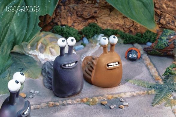Gary and Nigel the slugs sit in a garden with a Ladybird and another slug walking by discussing what food they dislike to an interviewer not in shot