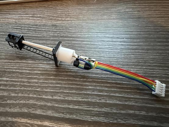 This image shows the assembled signal with the flat cable zip tied in place and soldered to the signal terminals