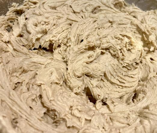 Close up of a bowl filled with chocolate chip less batter.