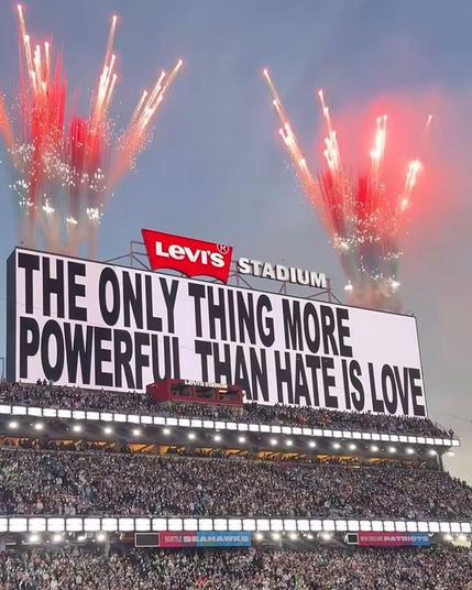 Sign at the super bowl: The only thing more powerful than hat is love