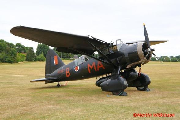 Westland Lysander parked on the grass at Old Warden during a Shuttleworth event.