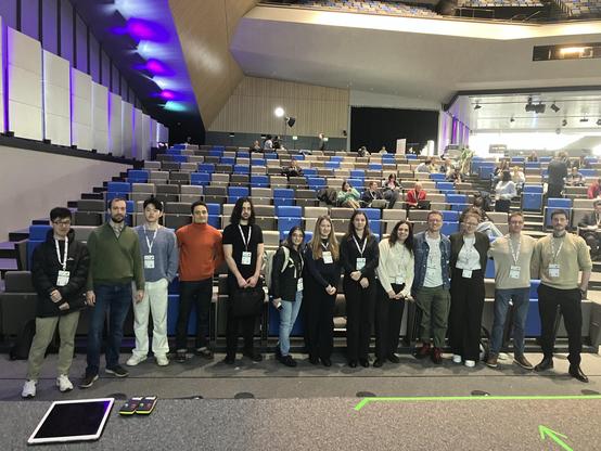 Scientists nervously standing for a selfie