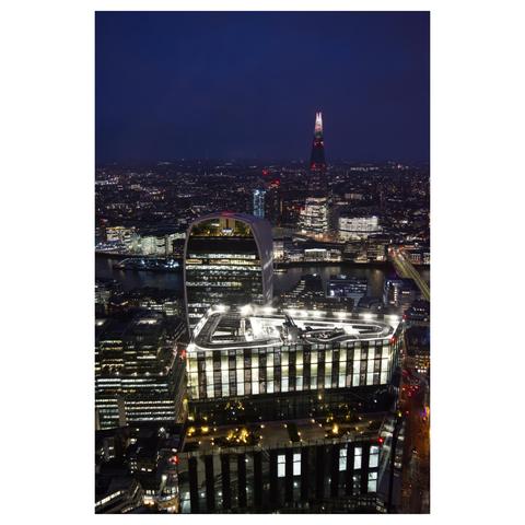 Dusk shot from 50 story viewpoint showing the Sky Garden and The Shard with London lit up.