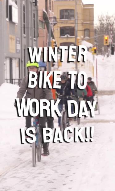 A photo of people cycling on very snowy urban cycle path. There’s a text overlay that reads “Winter bike to work day is back!!”