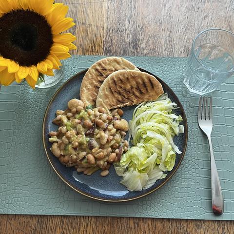 mixed salad of beans and spring onions paired with a crisp iceberg lettuce salad