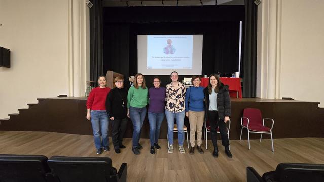 Group of women researchers from INAM ans teachers standing on the stage of a secondary school auditorium after a talk for the International Day of Women and Girls in Science (11F).