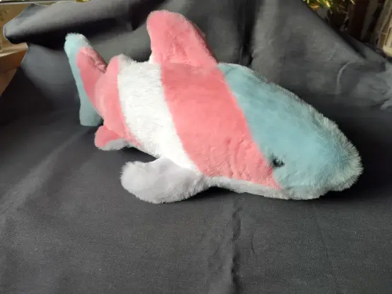 Other side if the floof shark with light blue, pink, white pink, light blue pattern.