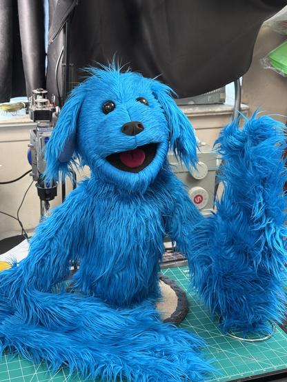 Right view of a furry blue dog live hands puppet