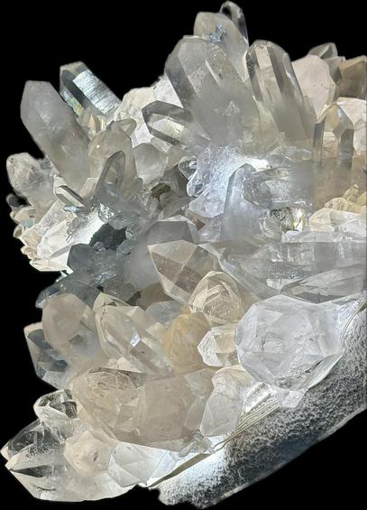 A black background was added by my iPhone after I shot the photo of gigantic quartz crystals. My post text explains the image. But this is a version of my original photo. iPhones give you a chance to select the main subject in foreground to copy just that. I then pasted it into my Notes where it appears like this photo BUT if I decide I want to download this new version to my Photos as a new image, the white background disappears and turns solid black.