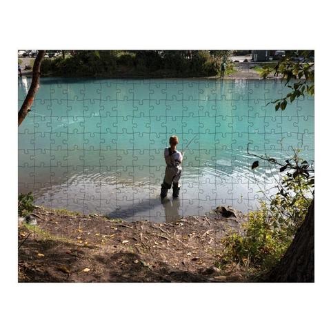 A boy fishes for silver salmon at a youth fishing derby at Eklutna Tailrace in Alaska