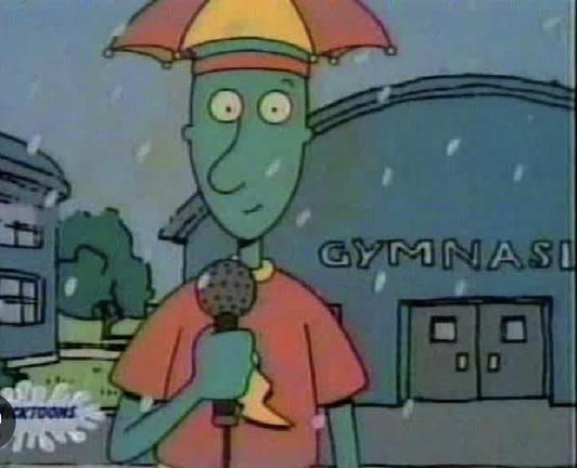picture of skeeter valentine reporting the weather in front of bluffington middle school gym
