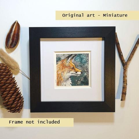 A tiny artwork of a portrait of a red fox in profile, with a grey and violet speckled watercolour background.
An original art work, please note that the frame is not included.
Watercolour and mixed media on white acid free artist watercolour paper.
Approximately 7.5 x 7.5cm, will fit a 3 x 3 inch photo frame.