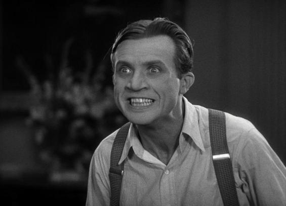 Dwight Frye as Renfield, smiling maniacally, in Dracula (1931)