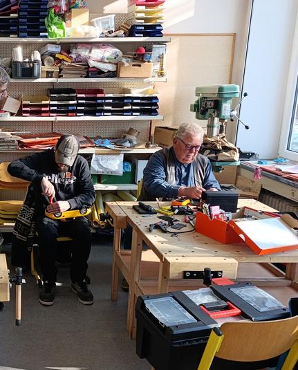 People repairing stuff