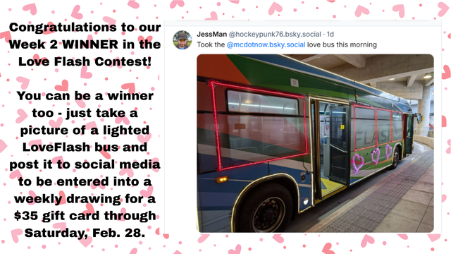 Bus at a station adorned with illuminated light strips creating a 'LOVEFLASH' message and hearts on its side.